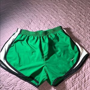 Dark green Nike athletic shorts.